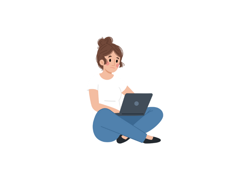 Woman is sitting on the floor working on her laptop.