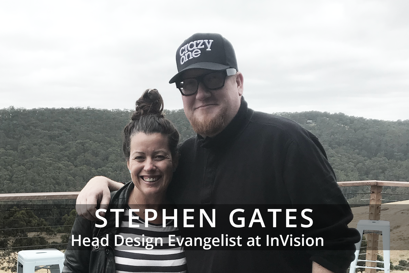 Female participants in a workshop sit in front of a graffiti wall.