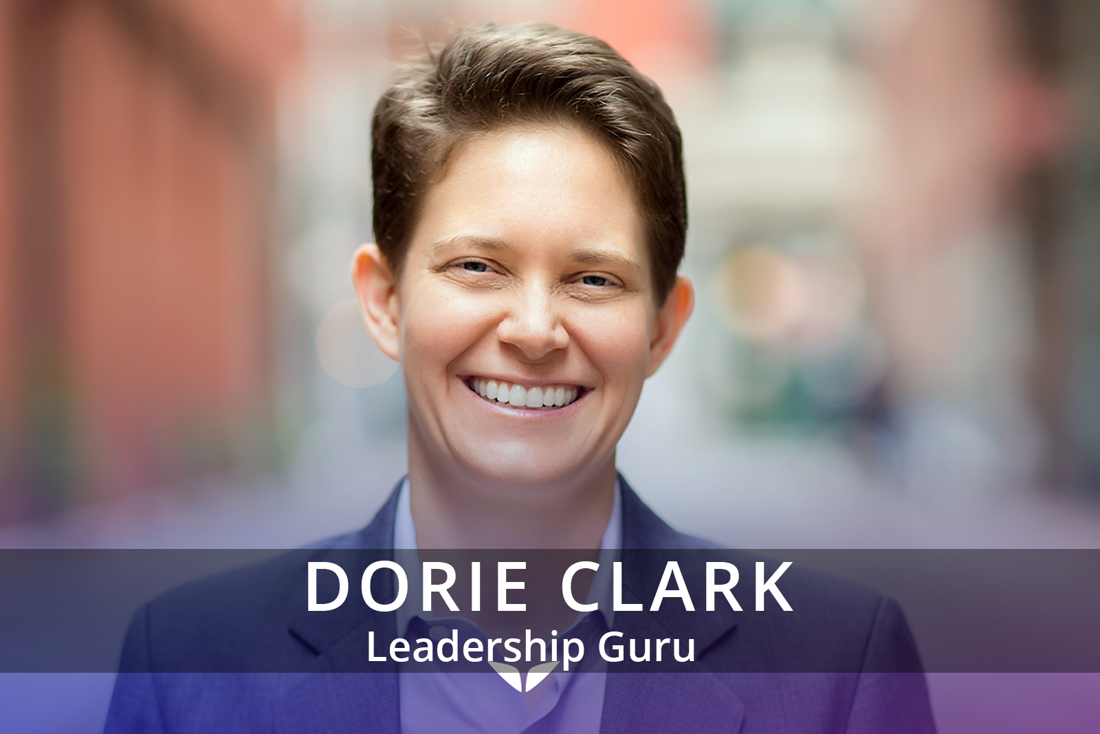 Female participants in a workshop sit in front of a graffiti wall.