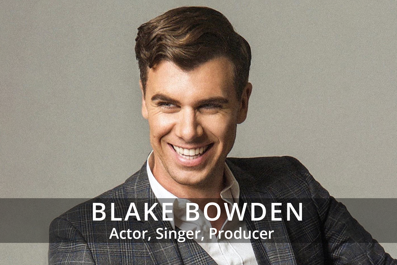 Female participants in a workshop sit in front of a graffiti wall.
