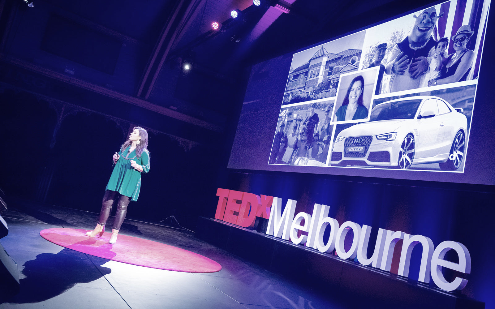 Female participants in a workshop sit in front of a graffiti wall.
