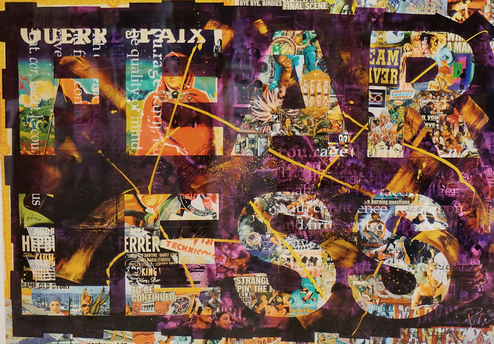 Female participants in a workshop sit in front of a graffiti wall.