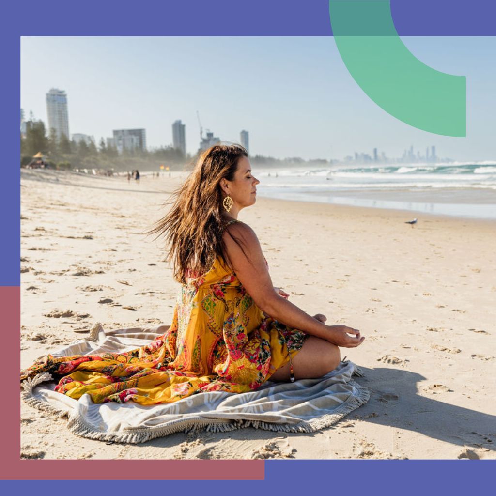 Woman is meditating on the beach.