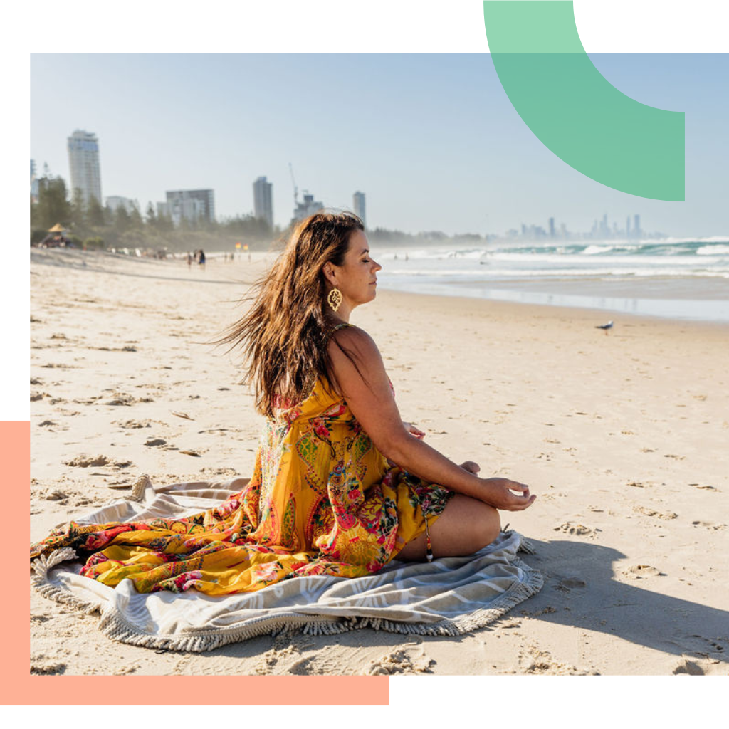 Woman is meditating on the beach.
